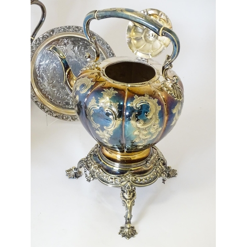 580 - A quantity of 19thC and later silver plated wares to include tea set, spirit kettle, serving dishes,... 