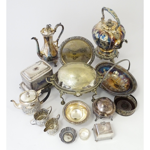 580 - A quantity of 19thC and later silver plated wares to include tea set, spirit kettle, serving dishes,... 