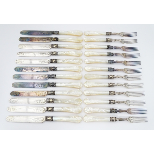 586 - A cased set of six close silver plate fruit knives and forks with mother of pearl handles. 12 1/2