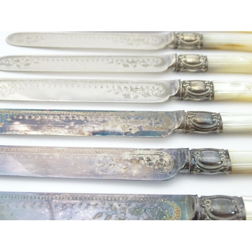 586 - A cased set of six close silver plate fruit knives and forks with mother of pearl handles. 12 1/2