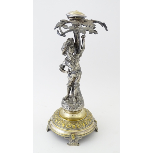 590 - A WMF Art Nouveau silver plate centrepiece formed as a boy under a tree. Approx. 13 1/2