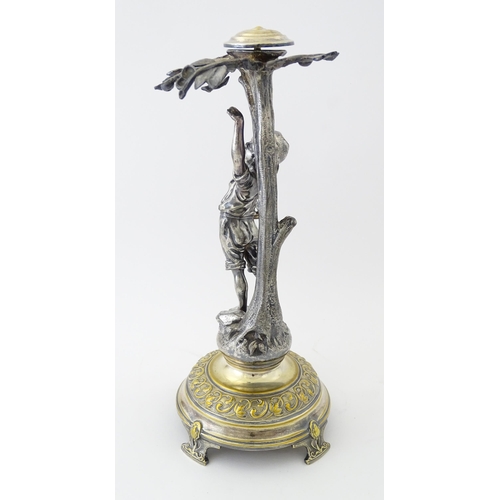 590 - A WMF Art Nouveau silver plate centrepiece formed as a boy under a tree. Approx. 13 1/2