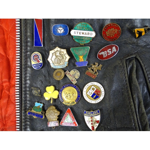 1287 - Vintage fashion / clothing: A vintage black leather biker jacket with a quantity of collectors badge... 