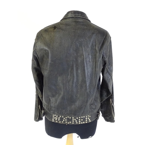 1287 - Vintage fashion / clothing: A vintage black leather biker jacket with a quantity of collectors badge... 