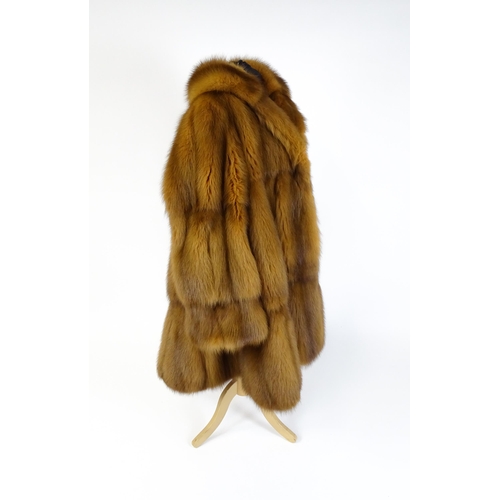 1299 - Vintage fashion / clothing: A vintage fur swing coat labelled Barone, Parma. Chest approx. 44