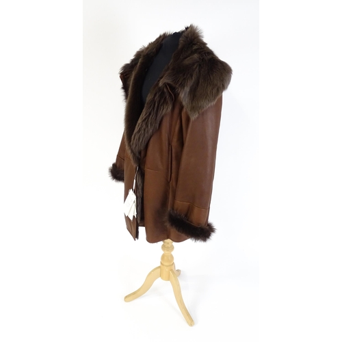 1306 - Vintage fashion / clothing: A MaxMara brown lamb leather jacket with fur lining, collar and cuffs. M... 