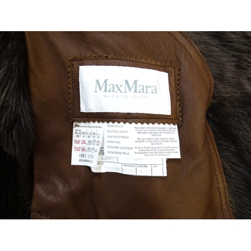 1306 - Vintage fashion / clothing: A MaxMara brown lamb leather jacket with fur lining, collar and cuffs. M... 