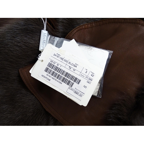 1306 - Vintage fashion / clothing: A MaxMara brown lamb leather jacket with fur lining, collar and cuffs. M... 