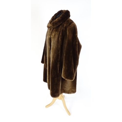 1307 - Vintage fashion / clothing: A mid length brown fur coat. Chest approx. 44