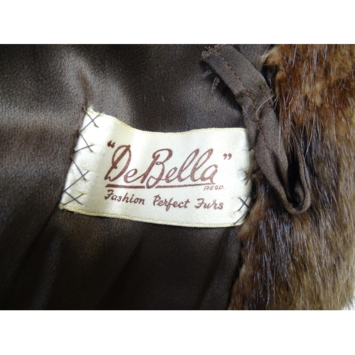 1312 - Vintage fashion / clothing: A mid length fur coat by De Bella. Bust approx. 44