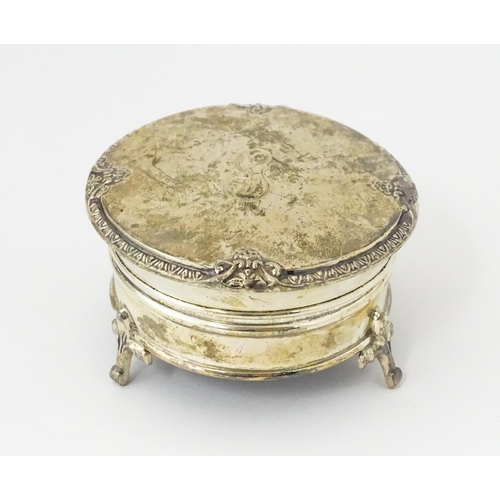 271 - A silver ring box raised on three feet. hallmarked Birmingham 1925 maker Adie Bros. 2 1/2