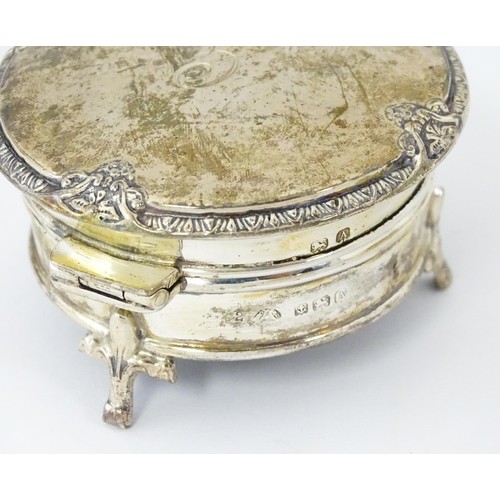 271 - A silver ring box raised on three feet. hallmarked Birmingham 1925 maker Adie Bros. 2 1/2