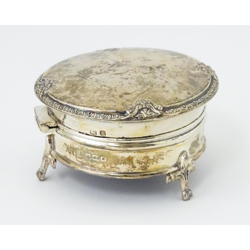 271 - A silver ring box raised on three feet. hallmarked Birmingham 1925 maker Adie Bros. 2 1/2