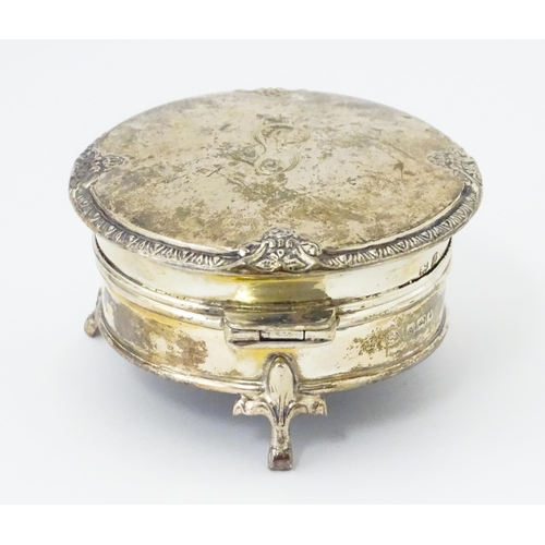 271 - A silver ring box raised on three feet. hallmarked Birmingham 1925 maker Adie Bros. 2 1/2