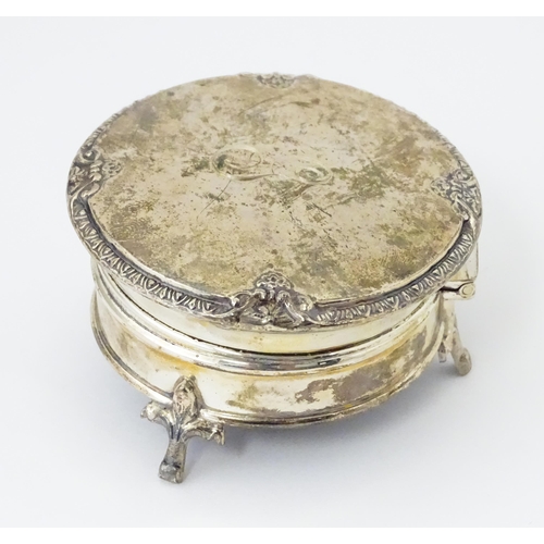 271 - A silver ring box raised on three feet. hallmarked Birmingham 1925 maker Adie Bros. 2 1/2