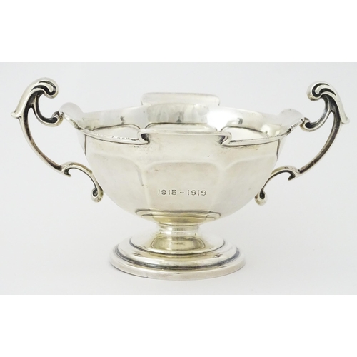 274 - A silver twin handled trophy bowl hallmarked Sheffield 1912, maker Walker & Hall. Approx. 7