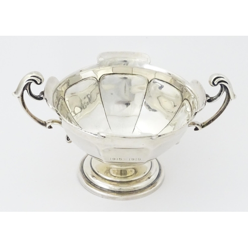 274 - A silver twin handled trophy bowl hallmarked Sheffield 1912, maker Walker & Hall. Approx. 7