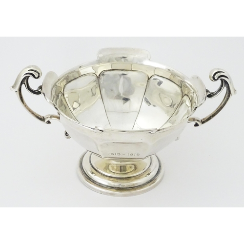 274 - A silver twin handled trophy bowl hallmarked Sheffield 1912, maker Walker & Hall. Approx. 7