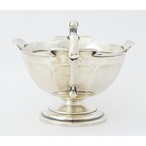 274 - A silver twin handled trophy bowl hallmarked Sheffield 1912, maker Walker & Hall. Approx. 7