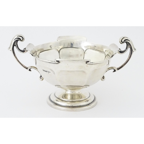 274 - A silver twin handled trophy bowl hallmarked Sheffield 1912, maker Walker & Hall. Approx. 7