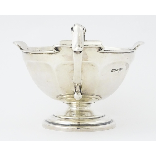 274 - A silver twin handled trophy bowl hallmarked Sheffield 1912, maker Walker & Hall. Approx. 7