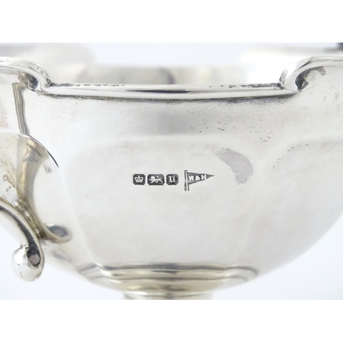 274 - A silver twin handled trophy bowl hallmarked Sheffield 1912, maker Walker & Hall. Approx. 7