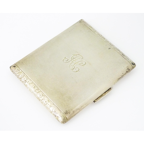 277 - A Continental .925 silver cigarette case with engine turned decoration and acanthus scroll banding. ... 