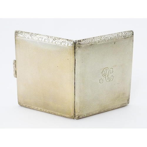 277 - A Continental .925 silver cigarette case with engine turned decoration and acanthus scroll banding. ... 