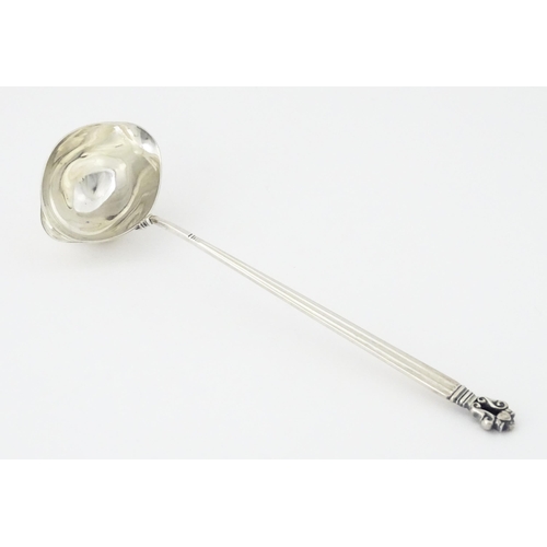 283 - A Georg Jensen acorn (konge) pattern silver ladle bearing import marks for Stockwell & Co (George St... 