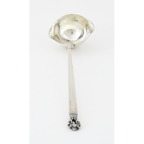 283 - A Georg Jensen acorn (konge) pattern silver ladle bearing import marks for Stockwell & Co (George St... 