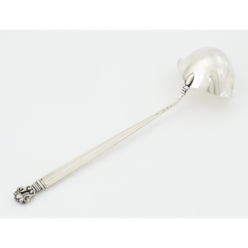 283 - A Georg Jensen acorn (konge) pattern silver ladle bearing import marks for Stockwell & Co (George St... 