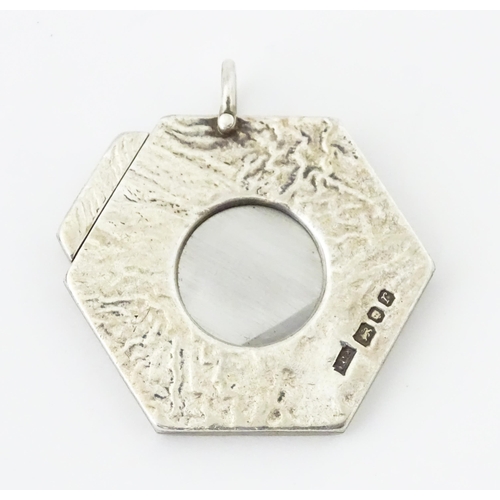 286 - A silver cigar cutter of hexagonal pendant form, hallmarked London 1972, maker Ramsdon and Roed. App... 