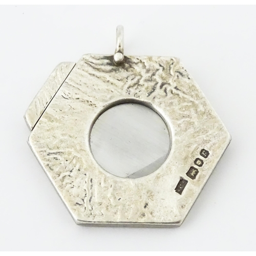 286 - A silver cigar cutter of hexagonal pendant form, hallmarked London 1972, maker Ramsdon and Roed. App... 