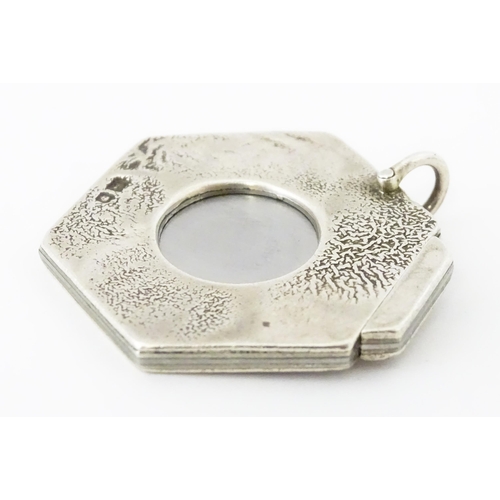 286 - A silver cigar cutter of hexagonal pendant form, hallmarked London 1972, maker Ramsdon and Roed. App... 