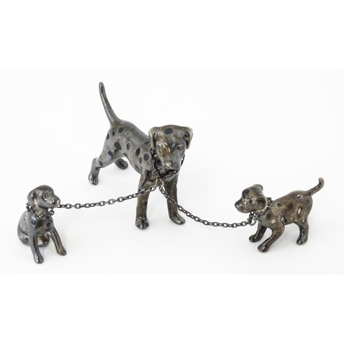 294 - A Continental silver model of a Dalmatian dog with two puppies. Approx 2 1/2