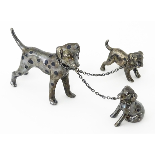 294 - A Continental silver model of a Dalmatian dog with two puppies. Approx 2 1/2