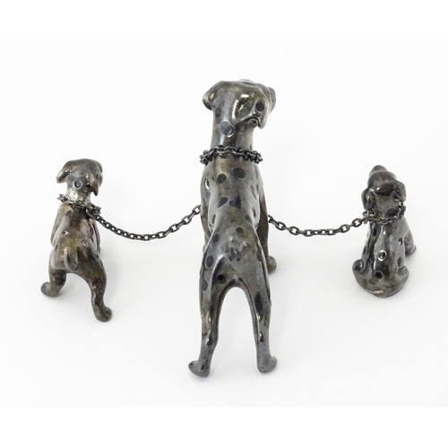 294 - A Continental silver model of a Dalmatian dog with two puppies. Approx 2 1/2