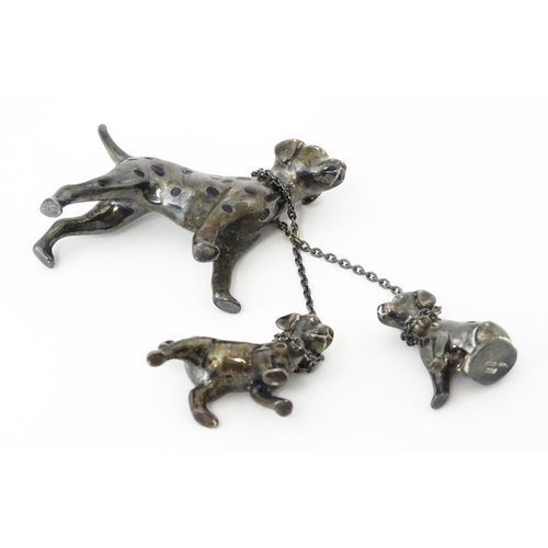 294 - A Continental silver model of a Dalmatian dog with two puppies. Approx 2 1/2