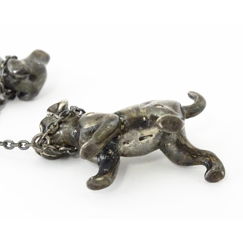 294 - A Continental silver model of a Dalmatian dog with two puppies. Approx 2 1/2