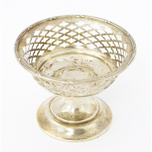 297 - A silver bon bon dish with pierced decoration and pedestal foot, hallmarked Birmingham 1911, maker E... 