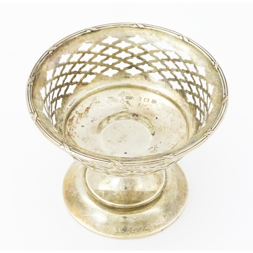 297 - A silver bon bon dish with pierced decoration and pedestal foot, hallmarked Birmingham 1911, maker E... 