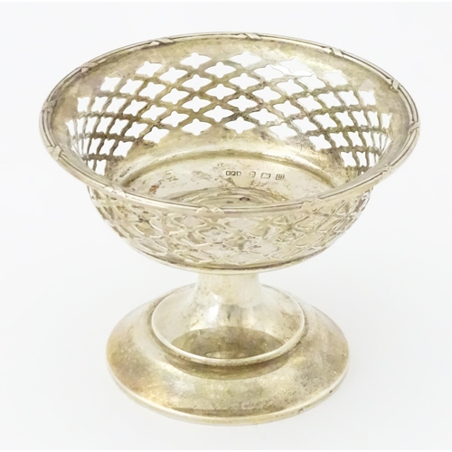 297 - A silver bon bon dish with pierced decoration and pedestal foot, hallmarked Birmingham 1911, maker E... 