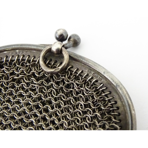 300 - A silver two sectional purse of mesh form bearing import marks for London 1915. Approx. 3 1/4