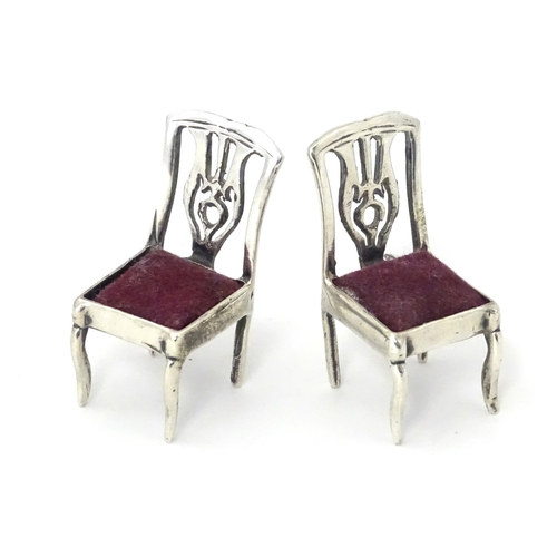 302 - Two .925 silver novelty pin cushions formed as a pair of chairs. Approx 1 1/4