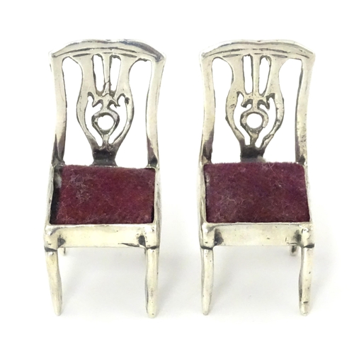 302 - Two .925 silver novelty pin cushions formed as a pair of chairs. Approx 1 1/4