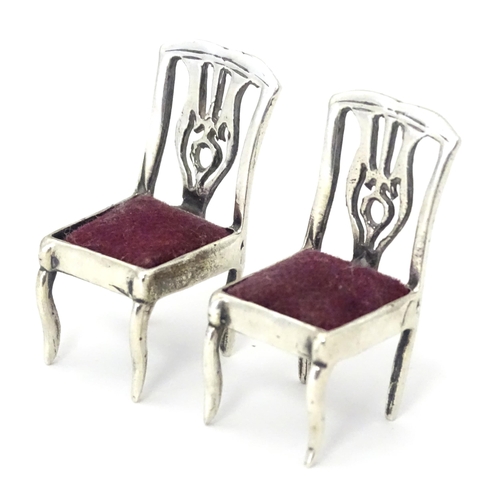 302 - Two .925 silver novelty pin cushions formed as a pair of chairs. Approx 1 1/4