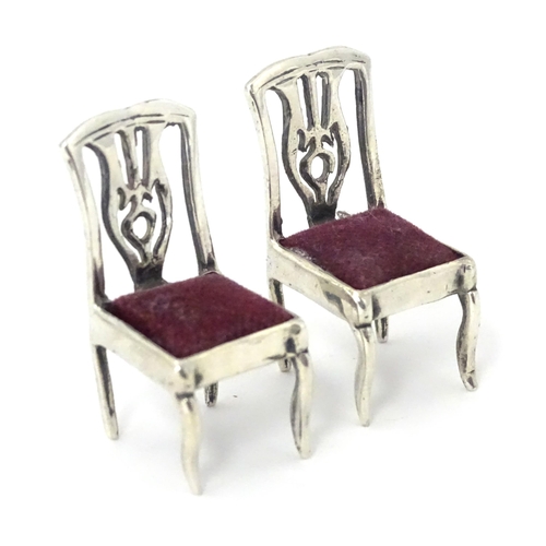 302 - Two .925 silver novelty pin cushions formed as a pair of chairs. Approx 1 1/4