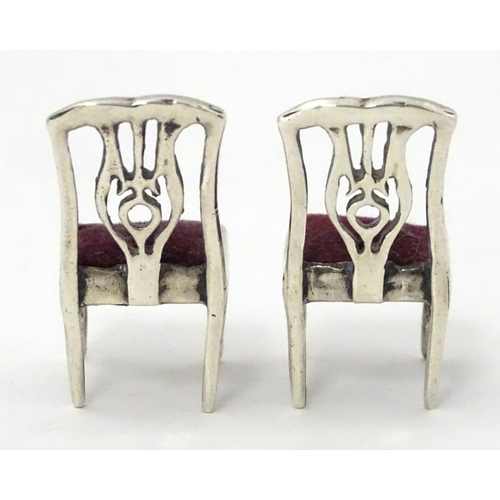 302 - Two .925 silver novelty pin cushions formed as a pair of chairs. Approx 1 1/4