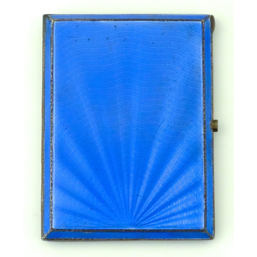 310 - An Art Deco silver cigarette case with blue guilloche enamel decoration and gilded interior, hallmar... 