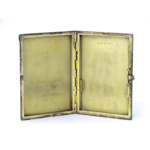 310 - An Art Deco silver cigarette case with blue guilloche enamel decoration and gilded interior, hallmar... 